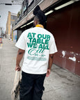 At Our Table We All Eat Tee